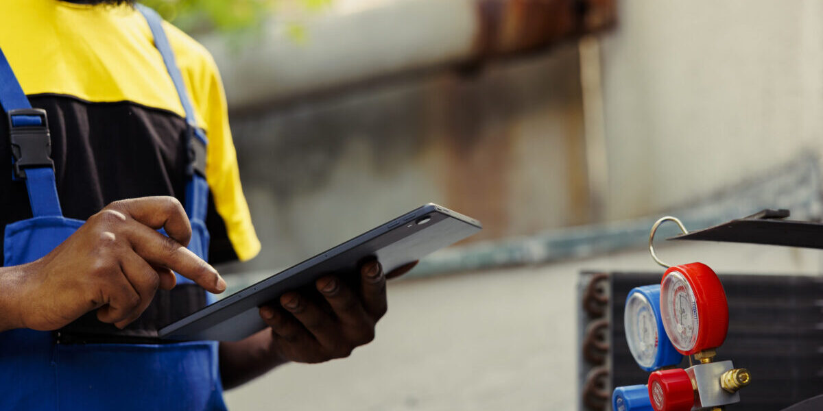 Electrician doing hvac system leak check